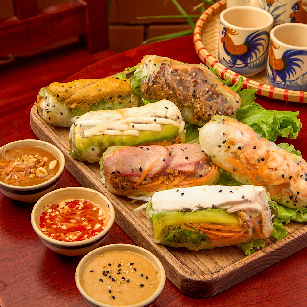 Assorted fresh Vietnamese spring rolls with sauces at Roly Poly Da Nang