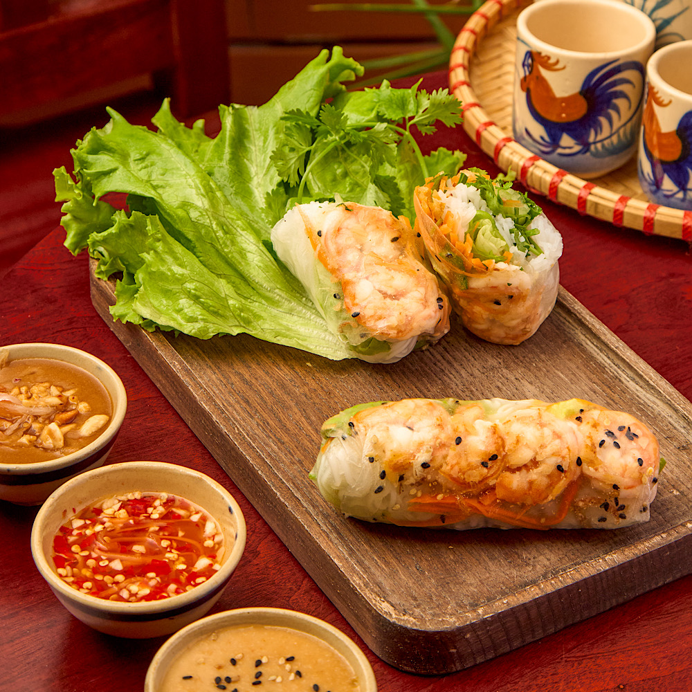 Garlic prawn Vietnamese rice paper roll dipped into nước chấm at Roly Poly Fresh Spring Rolls & Coffee Da Nang