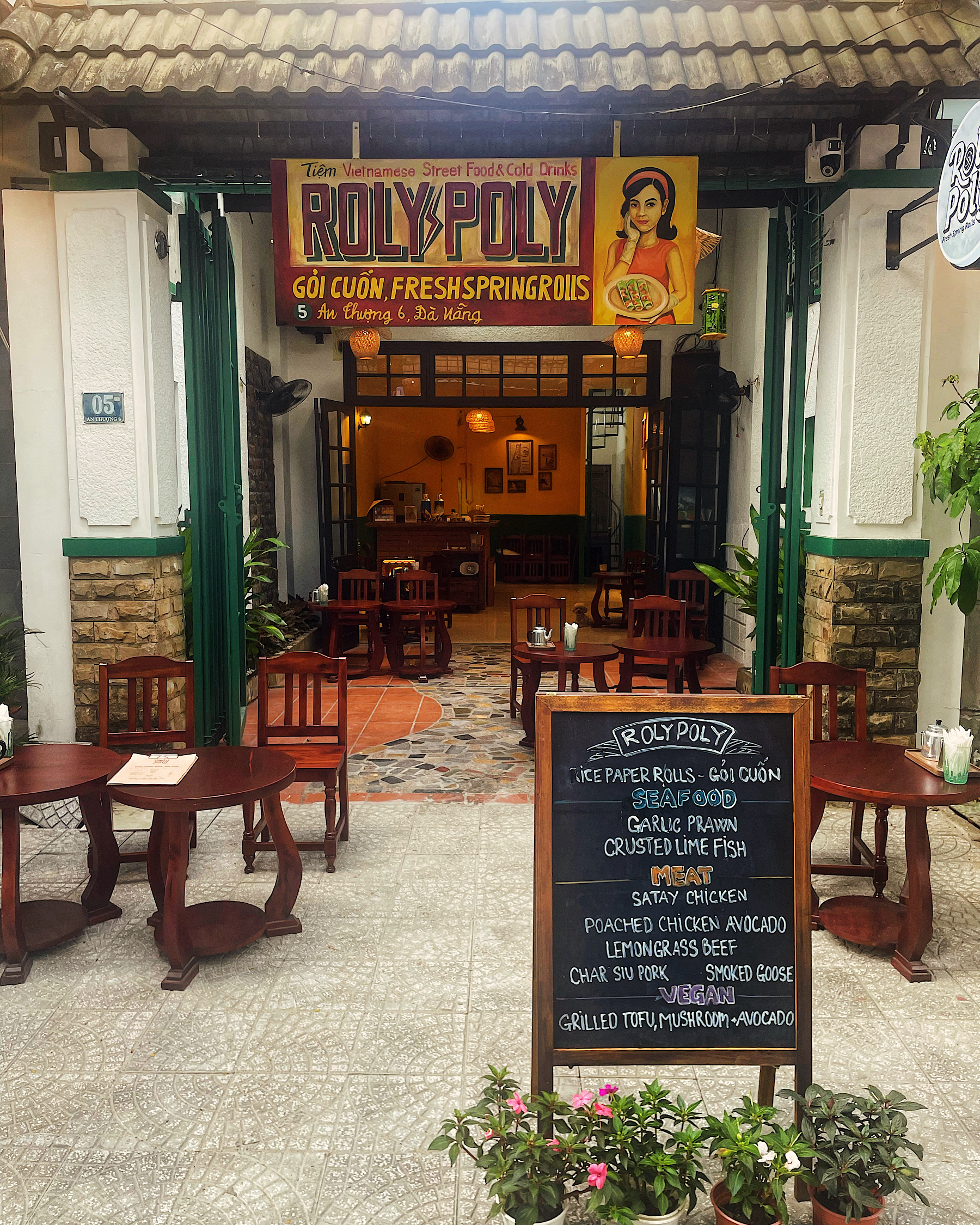 Shopfront of Roly Poly Café in Da Nang, serving fresh spring rolls and specialty drinks
