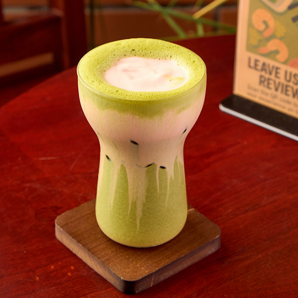 Iced strawberry matcha latte poured over ice at Roly Poly Fresh Spring Rolls & Coffee Da Nang