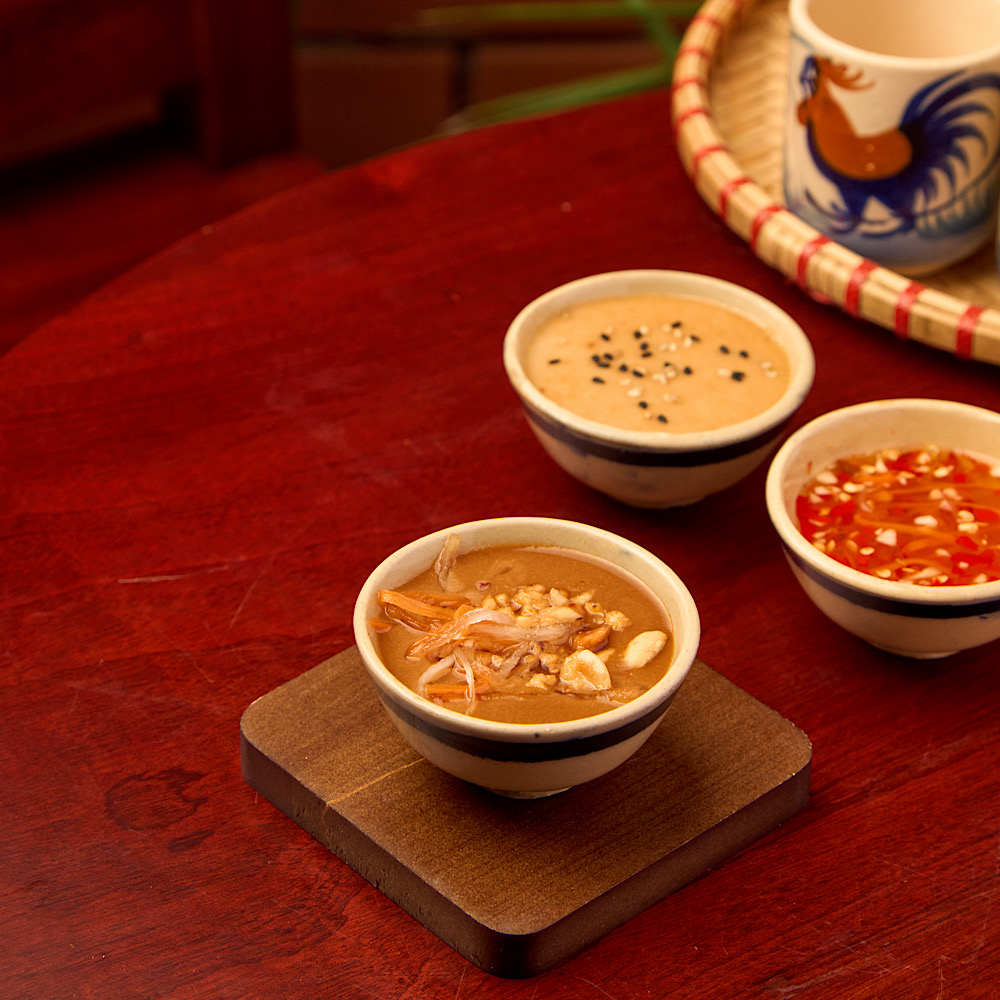 Vietnamese peanut, sesame, and fish dipping sauces served with fresh spring rolls at Roly Poly Da Nang